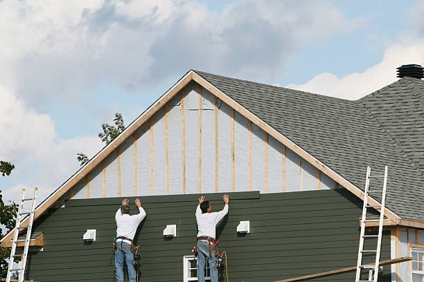Professional Siding technician working in Naperville, IL
